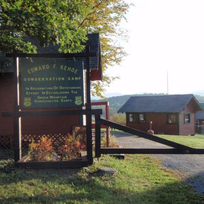 Camp Kehoe sign and cabin