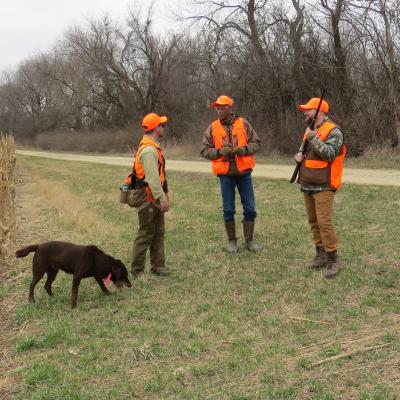 Participant with their instructor and hunting guide.